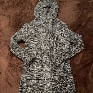 Black and white sweater coat; cotton/wool blend. Size large.